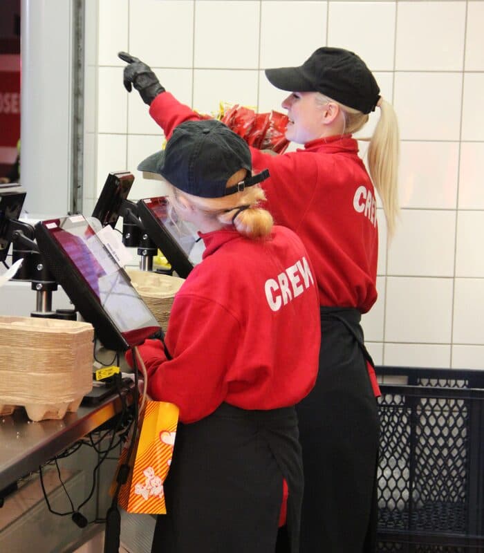 Two crew members coordinating seamlessly at a live event