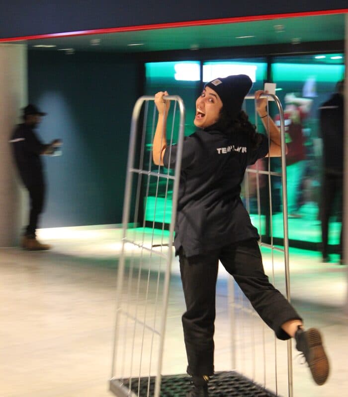 Team member having fun while moving equipment